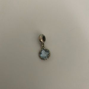 Pandora Cool Breeze sterling silver dangle charm with blue topaz. Retired